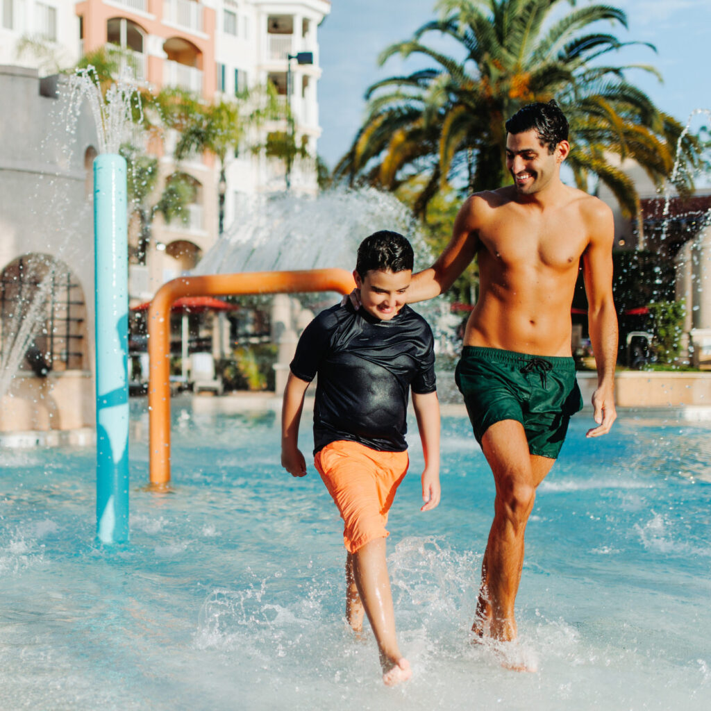 Father and son at the pool